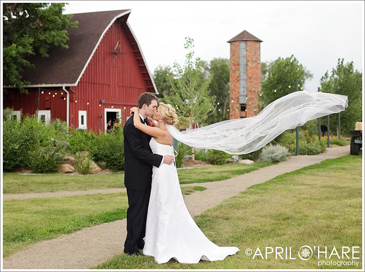 Barn backdrop for a couples portrait from a Littleton wedding photographer in Colorado