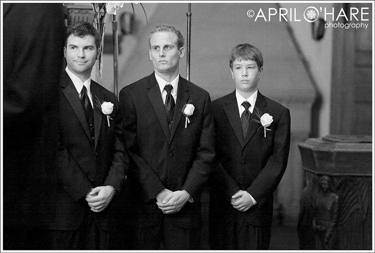 Groomsmen being serious during the ceremony