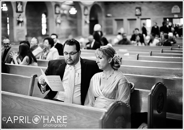 A beautiful B&W photo of wedding guests waiting at St. Catherine's in Denver, CO