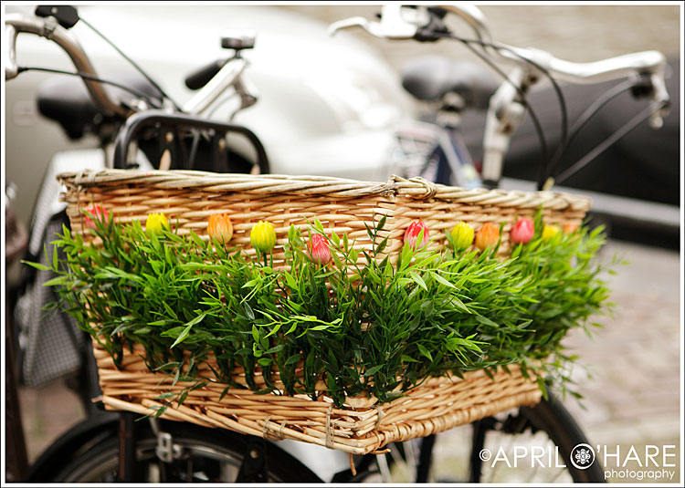 A flower decorated bike handlebar basket in Amsterdam