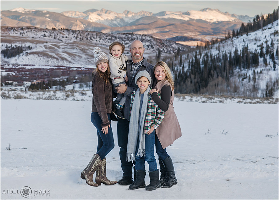 Family Photos at C Lazy U Ranch During Winter with Pretty Sunset Mountain Backdrop