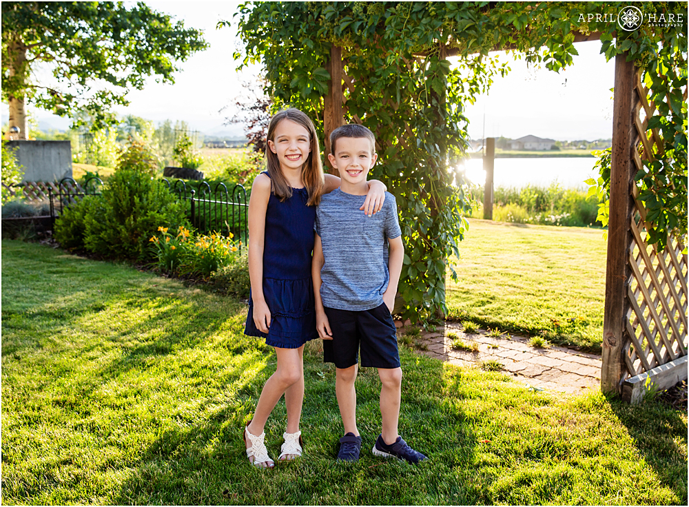 Brother and sister portrait on a bright sunny day in Loveland Colorado