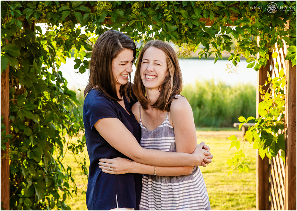 Sisters laugh together during their family pictures in Loveland Colorado