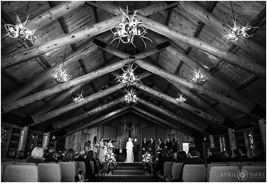 Beautiful log cabin style church with antler chandeliers for a Winter Wedding in Breckenridge