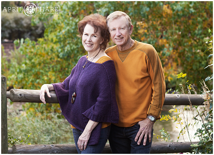 Grandparents wearing purple and mustard at fall color Clear Creek History Park Family Photos