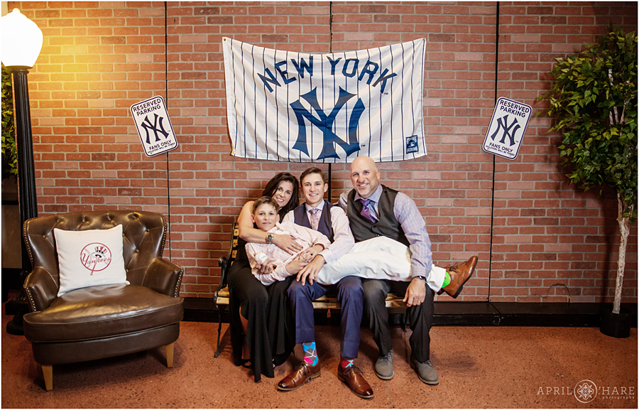 Cute family candid photo for a New York Yankees baseball themed bar mitzvah at Coors Field in Denver Colorado
