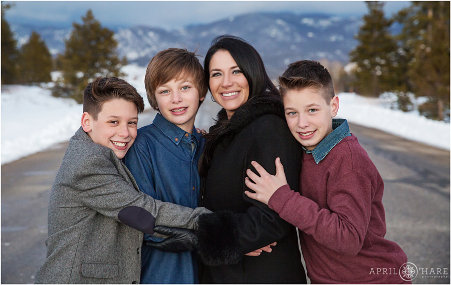 Three boys with their mom on their Colorado winter vacation to Lake Granby 