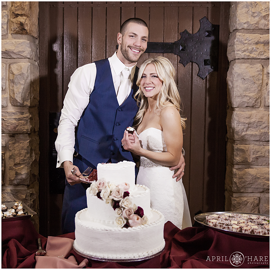 Cake cutting indoors at Denver winter mansion wedding