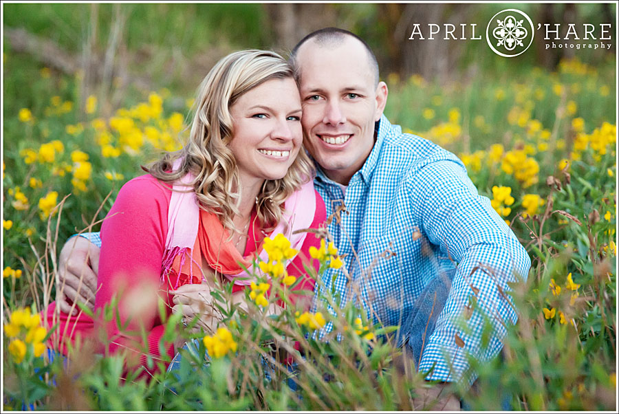 Castle Rock Engagement Photos During Spring with field of yellow wildflowers at Columbine Open Space