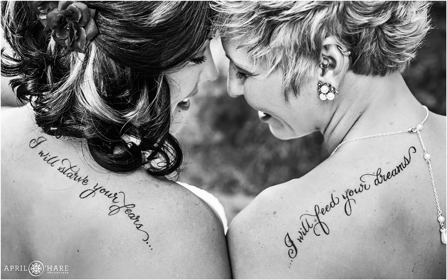 Complimentary tattoos on two brides at a backyard lesbian wedding