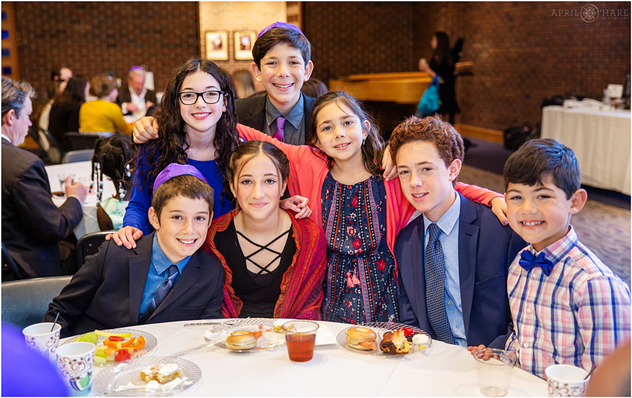 Group of cousins pose for a candid portrait during the kiddush at a Temple Emanuel Bat Mitzvah luncheon in Denver
