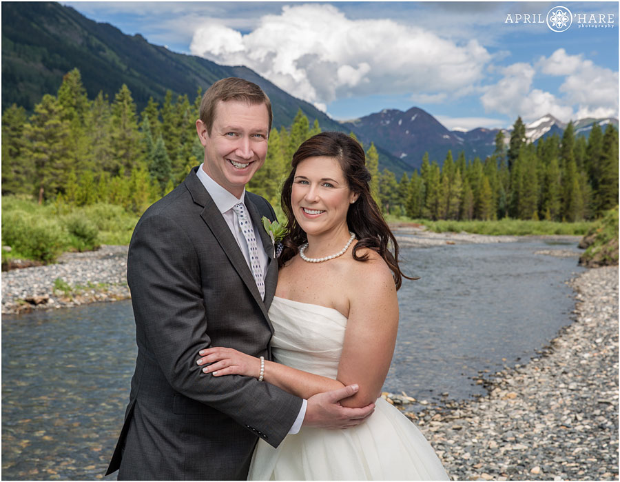 Bright and Sunny Wedding Day next to the Slate River from a Crested Butte wedding photographer