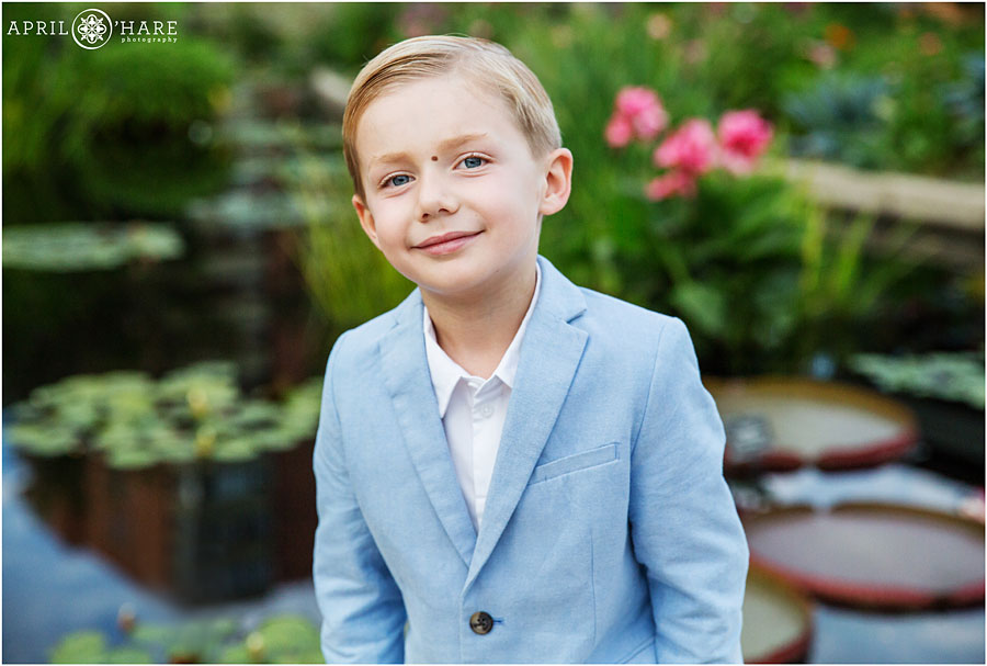 Little boy wearing a light blue suit at his family's professional photo shoot at Denver Botanic Gardens