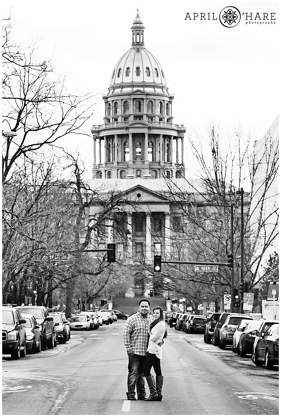 Colorado State Capitol in the backdrop of a Downtown Denver engagement photos session during winter