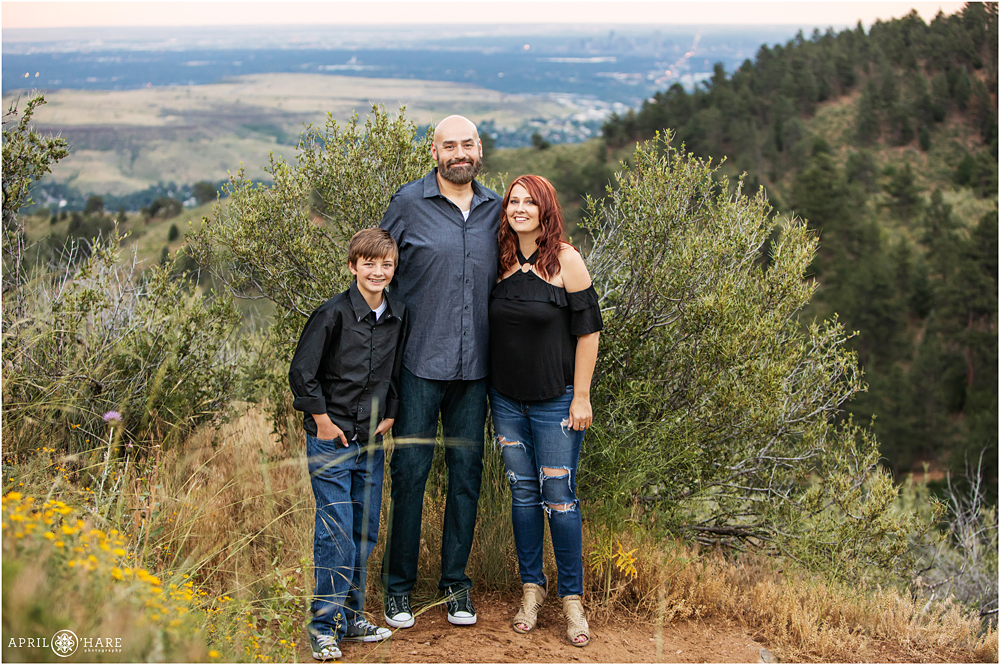 A family poses on the Chimney Gulch Trail at Lookout Mountain with Views of Denver