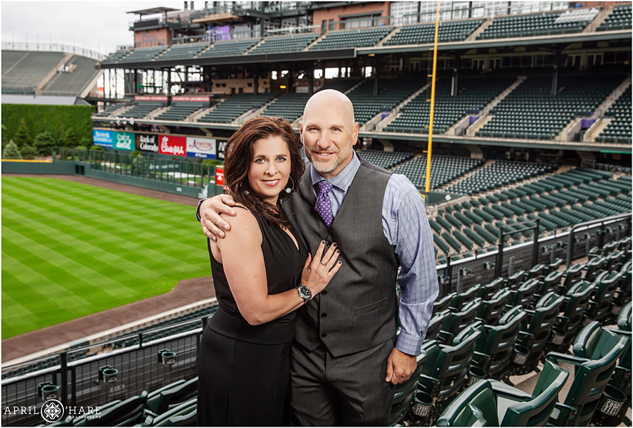 Parent photo together at their son's baseball themed bar mitzvah at Coors Field in Denver