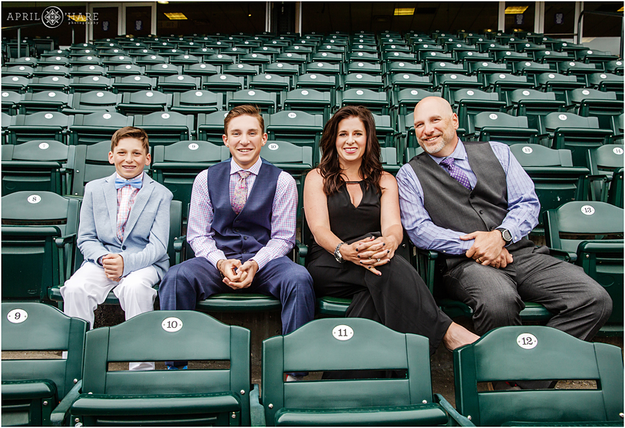 Super cute family picture in the stands at baseball themed bar mitzvah at Coors Field in Denver