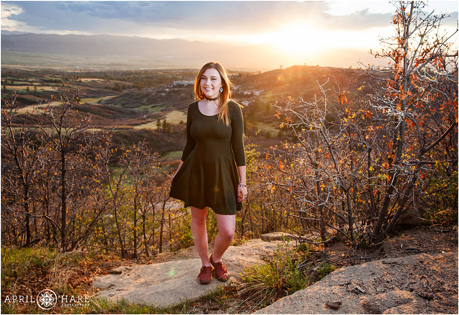 Cute senior portrait of a girl in a green dress at Daniels Park for her Highlands Ranch Senior Photos