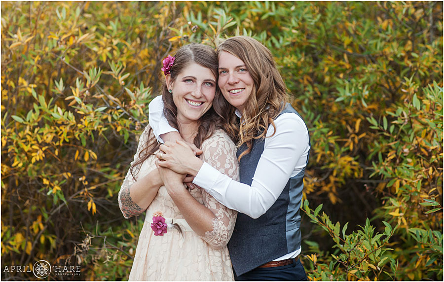 Cute picture of two brides cuddling at their Colorado Lesbian Wedding
