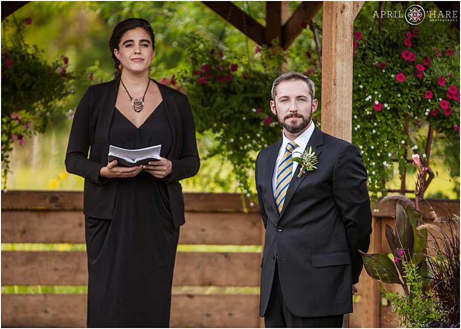 Groom Looks at his Bride at their Rustic Colorado Wedding Ceremony at Chatfield Farms