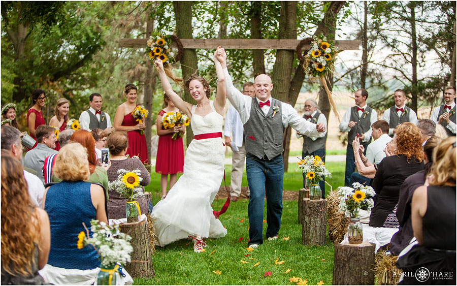 Happy Couple Dances out of their wedding ceremony at their Nebraska Farm Wedding