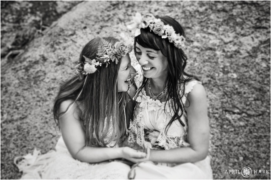 Sweet brides laugh together on their wedding day at their Colorado Lesbian Elopement