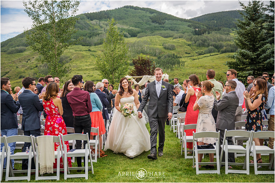 Happy wedding ceremony outdoors from a Crested Butte wedding photographer