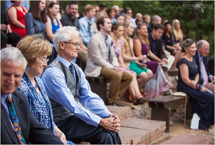 Guests at outdoor amphitheater at Colorado Summer Camp Wedding