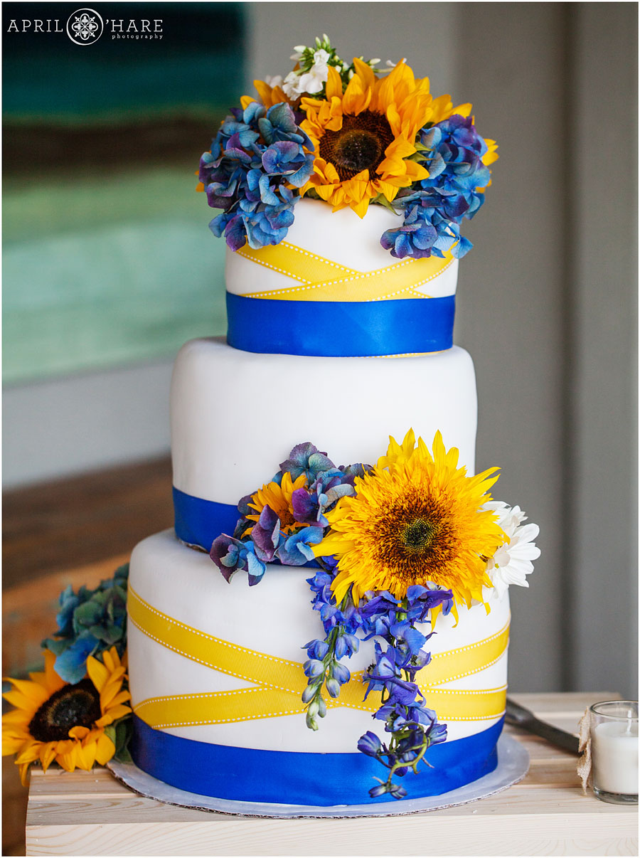 Blue with yellow sunflowers wedding decor at backyard Colorado wedding