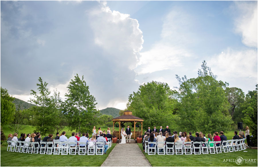 A Pretty Wide Angle View of a Denver Garden Wedding Ceremony at Chatfield Farms 