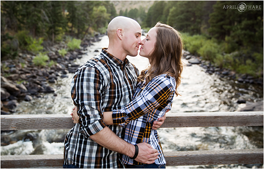 Pretty romantic engagement photos at the Grey Rock trailhead with the Poudre River in the backdrop