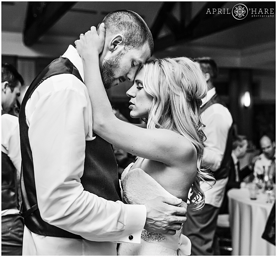 Romantic B&W dance floor photo of bride and groom at their Denver winter mansion wedding