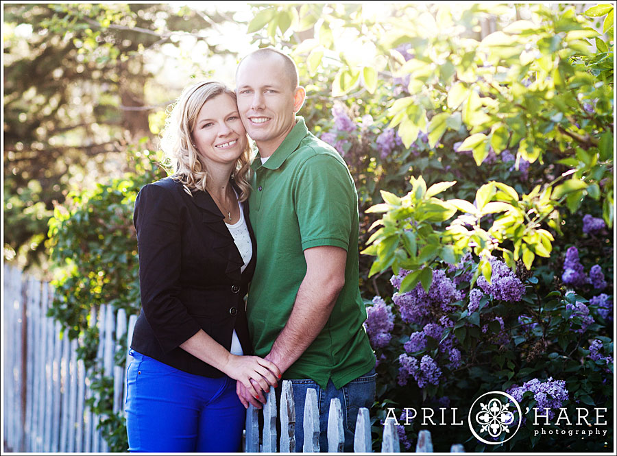 Castle Rock Engagement Photos with lilac blossoms during spring in Downtown Castle Rock