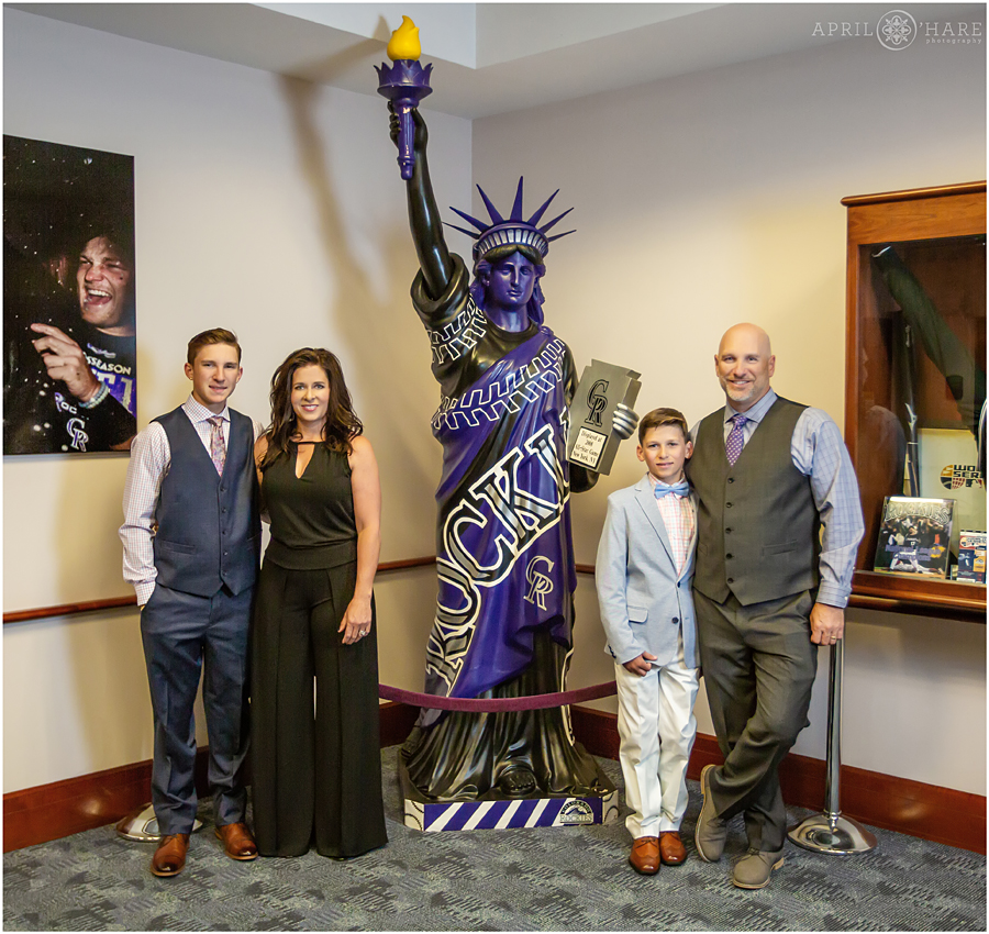 Cute family photo with the Statue of Liberty wrapped in Rockies logo at a Yankees themed bar mitzvah party at Coors Field