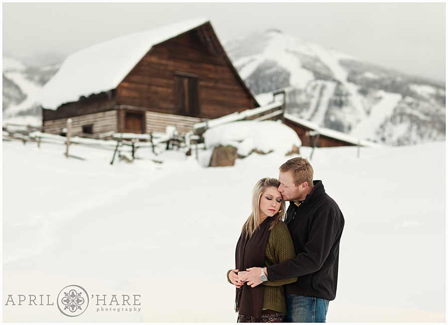 Winter Steamboat Springs Family Photos with ski resort and More Barn backdrop in Colorado