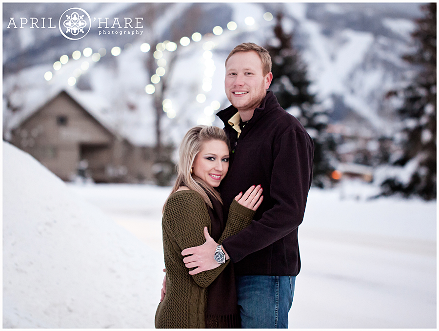 Couples photos in Steamboat with Night Skiing Lights in the backdrop