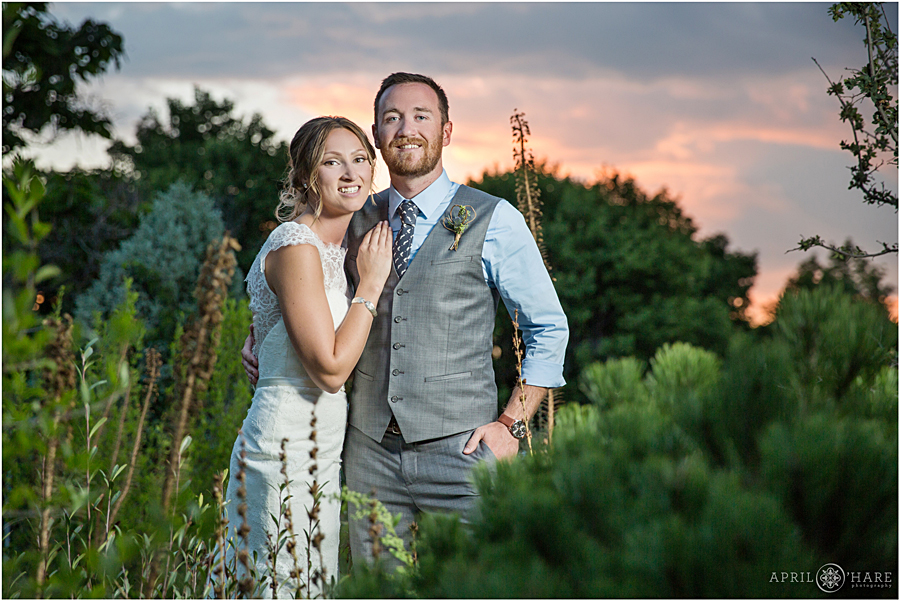 Couple portrait at sunset in the garden at Deer Creek Stables Wedding Reception at Chatfield Farms in Colorado