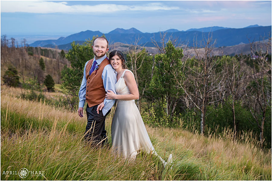 Cute wedding couple with mountain views at Colorado Summer Camp Wedding