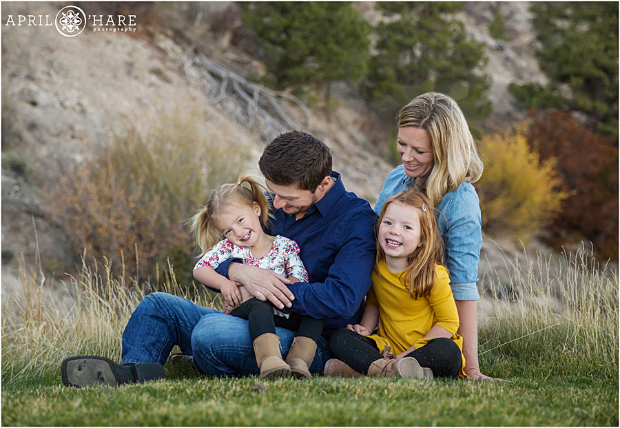 Happy laughing photos of a family of four with their Glenwood Springs Family Photographer