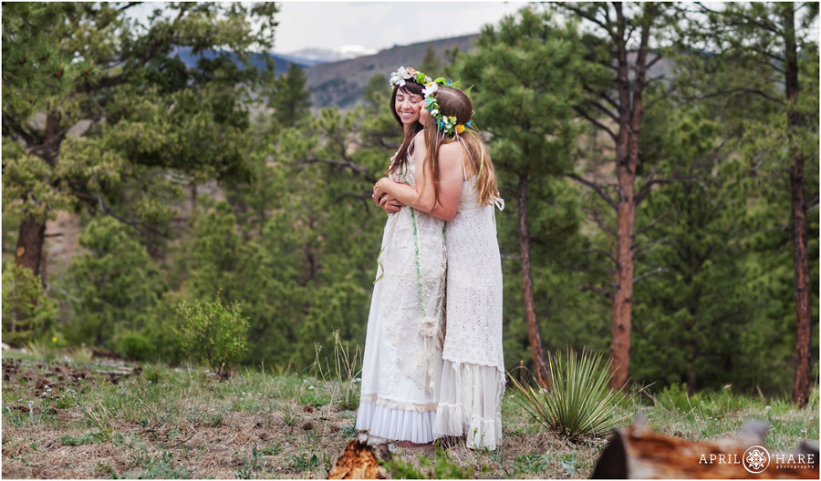 Sweet picture of two brides in the woods at their Colorado Lesbian Elopement