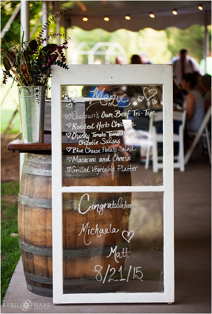 Wedding Menu written on vintage window frame for a Deer Creek Stables wedding at Chatfield Farms