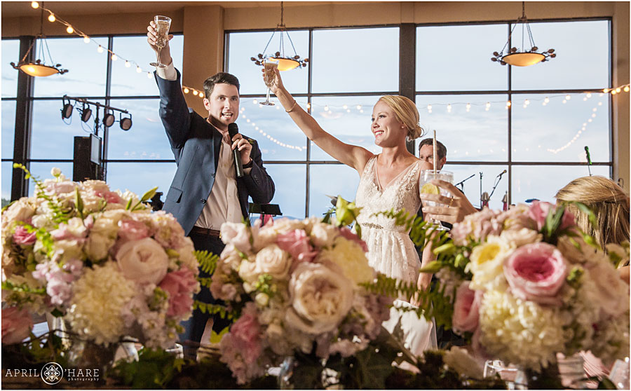 Toasts at a wedding with pale pink decor