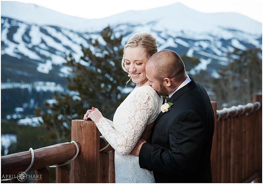 Sweet wedding photo with Breckenridge ski resort backdrop at their Winter Wedding in Breckenridge