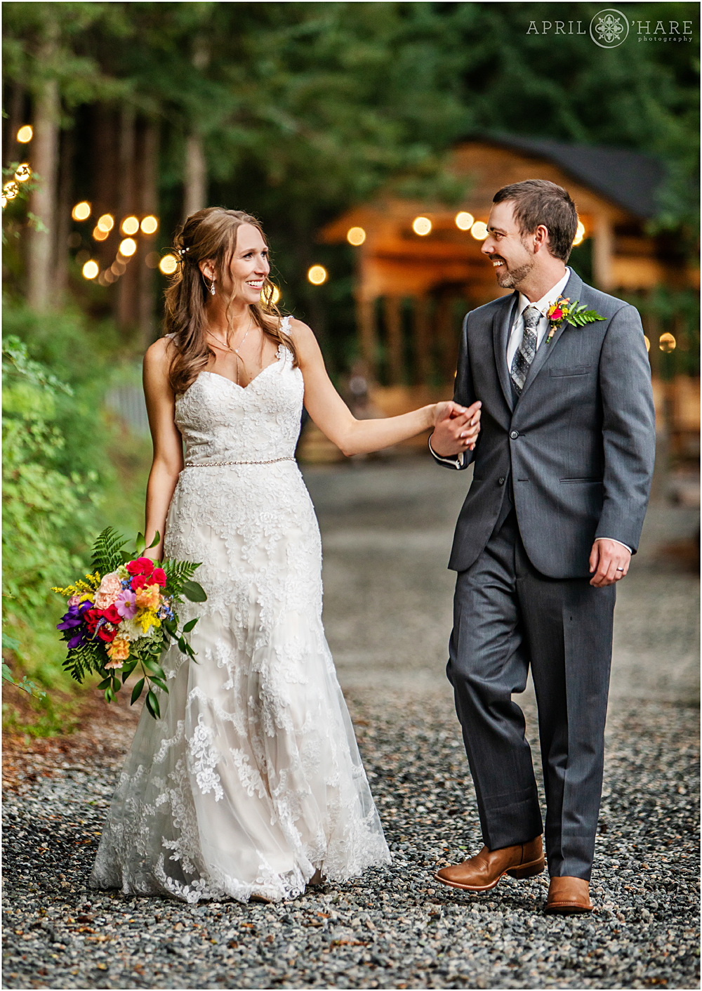 Bride and groom hand in hand at Blackstone Rivers Ranch