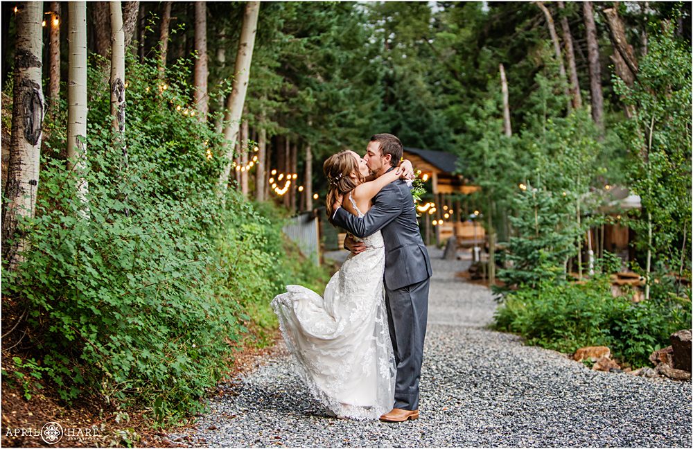 Dramatic kiss photo of bride and groom at Blackstone Rivers Ranch in Colorado