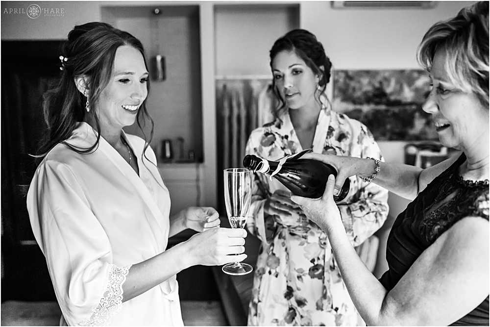 Pouring champagne in bridal suite at Blackstone Rivers Ranch