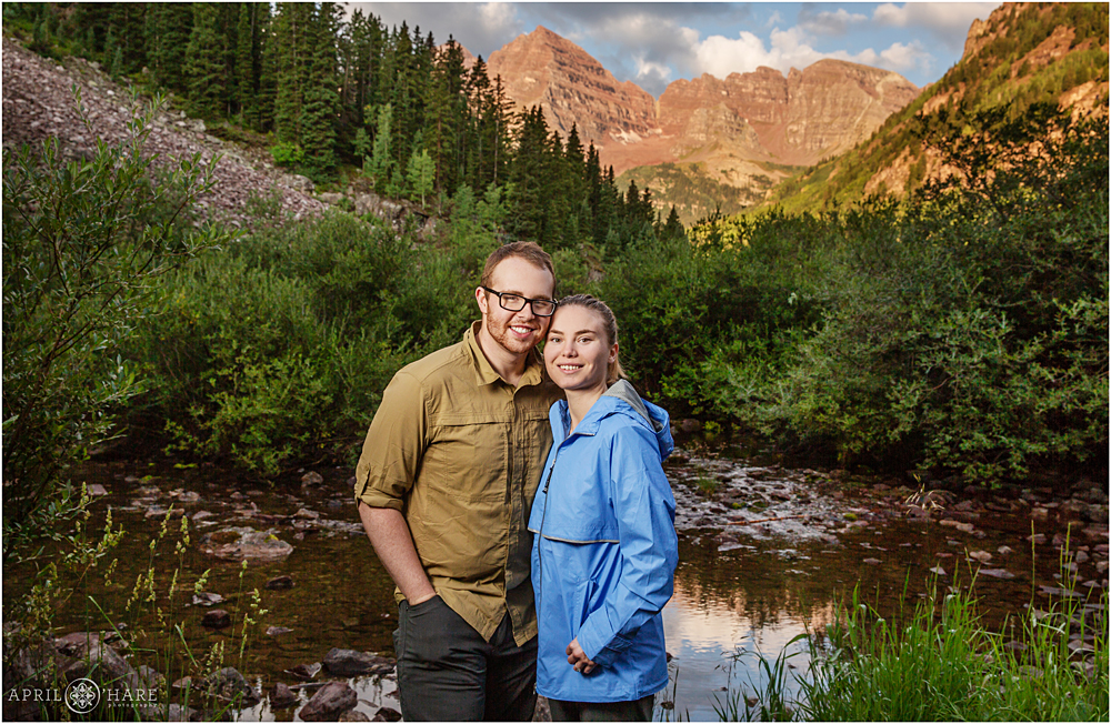 Beautiful portrait of a young couple in front of Maroon Bells early in the morning