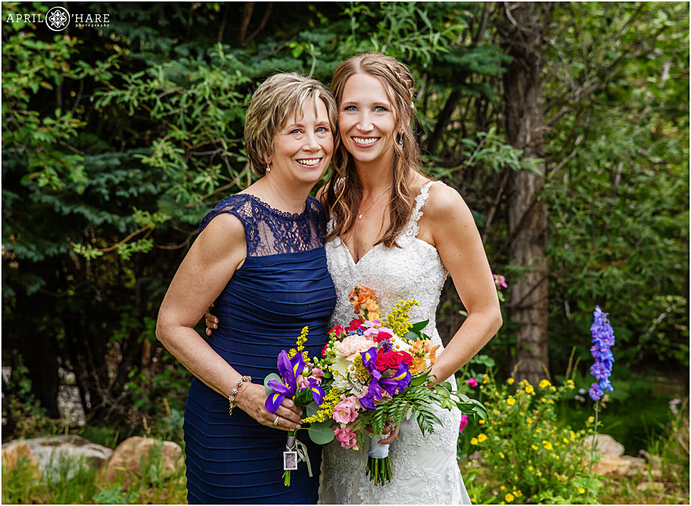 Mom and Bride pose for a portrait 