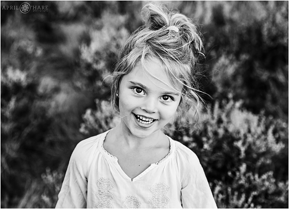 B&W portrait of a little girl in the Colorado mountains