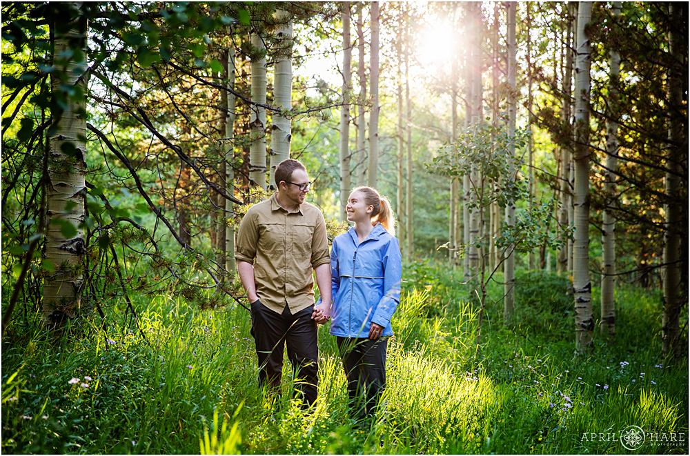 Beautiful morning light pours into the Aspen forest engagement photography at Maroon Bells